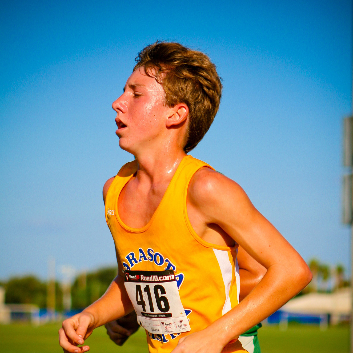 Young man sweating while running